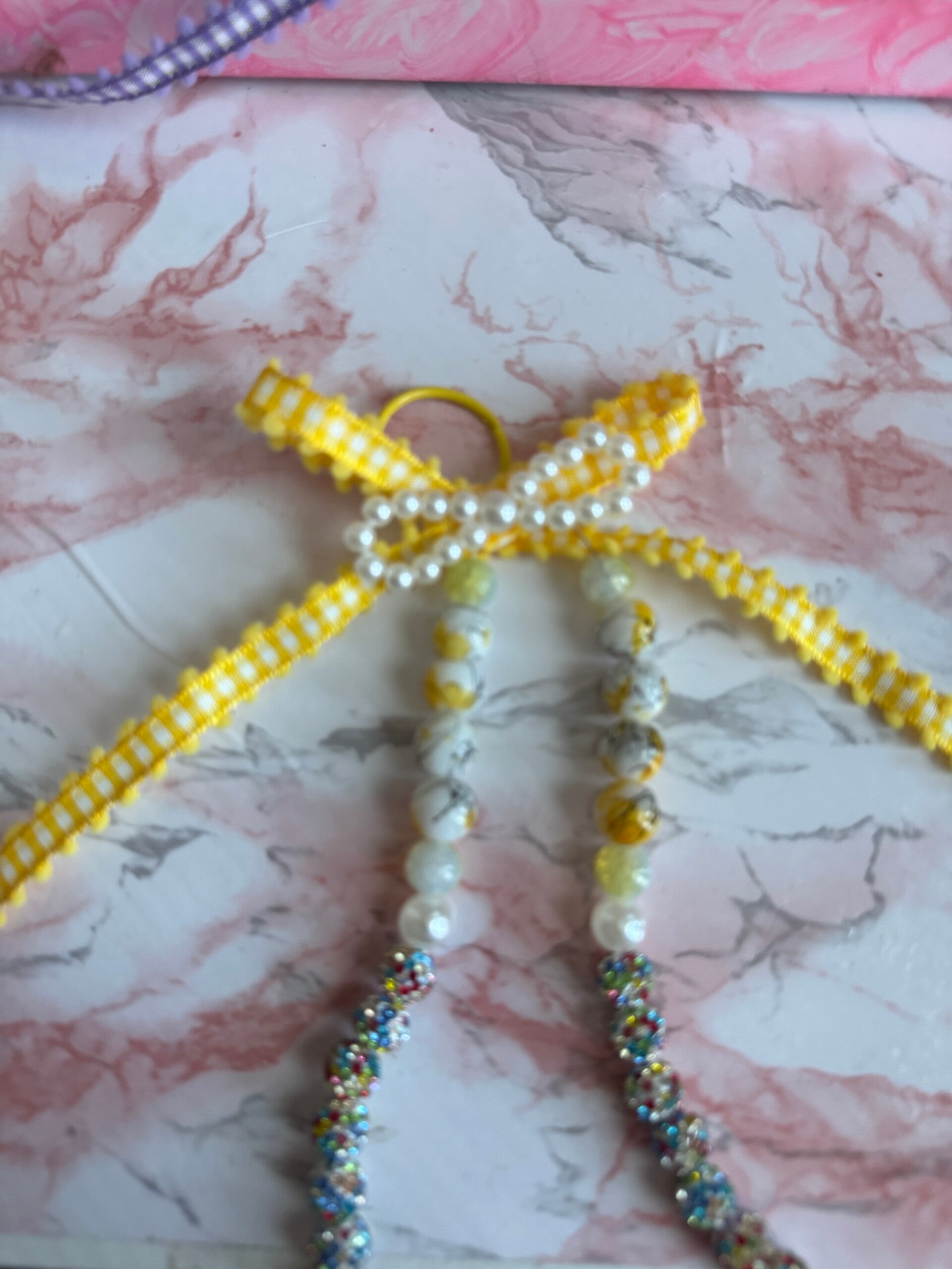 Yellow beaded bow