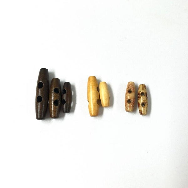 Houten knebels, houtje touwtje knopen