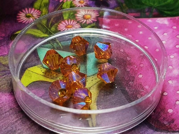 Swarovski Toupies Padparadscha AB 2x 6mm/8st