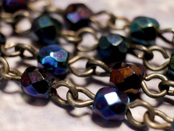 Metalen kettingen met 4 mm facetkralen iris blauw