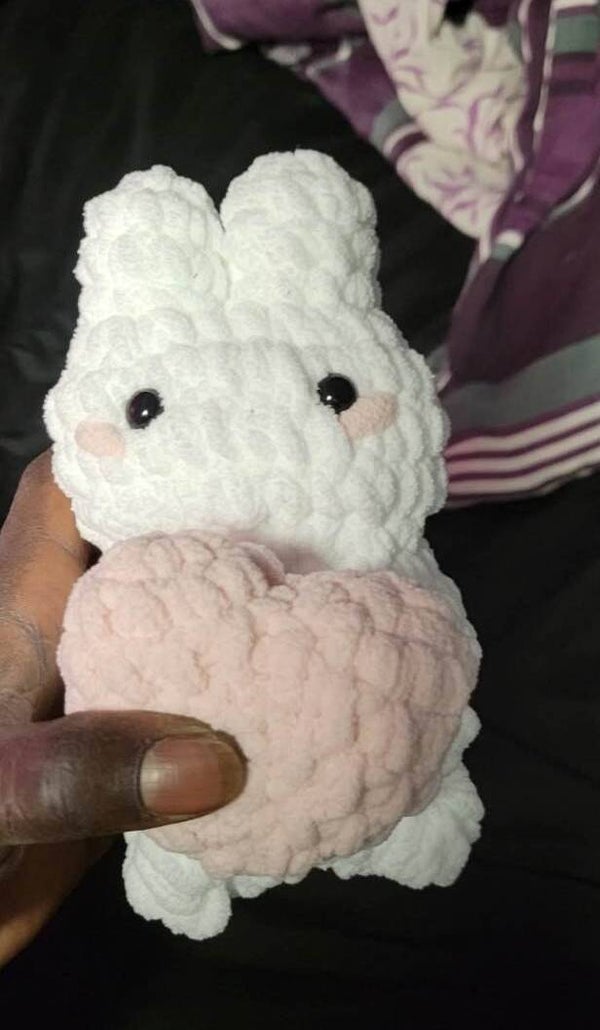 A bunny holding a heart