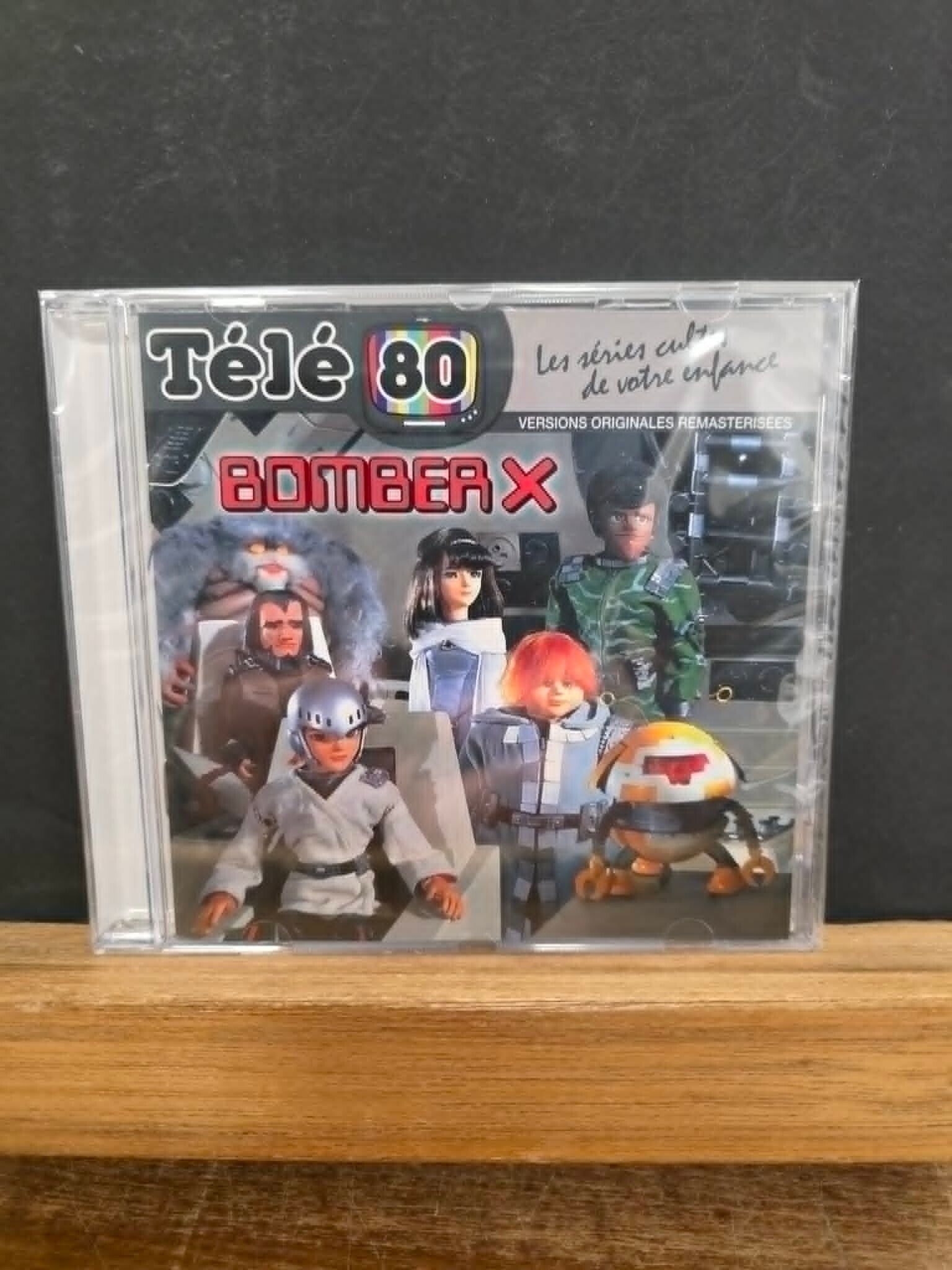 TELE 80 - LES SERIES CULTES DE VOTRE ENFANCE - BOMBER X - NEUF SOUS CELLO