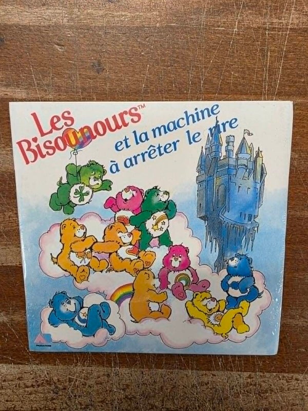 45 TOURS - LIVRE DISQUE - LES BISOUNOURS ET LA AMCHINE A ARRETER LE RIRE - NEUF SOUS CELLO