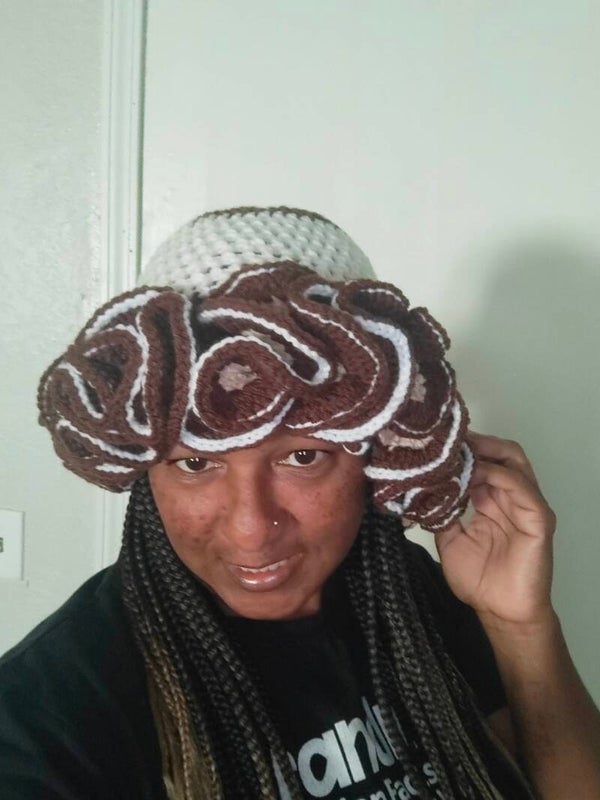 Brown and white hat with ruffles