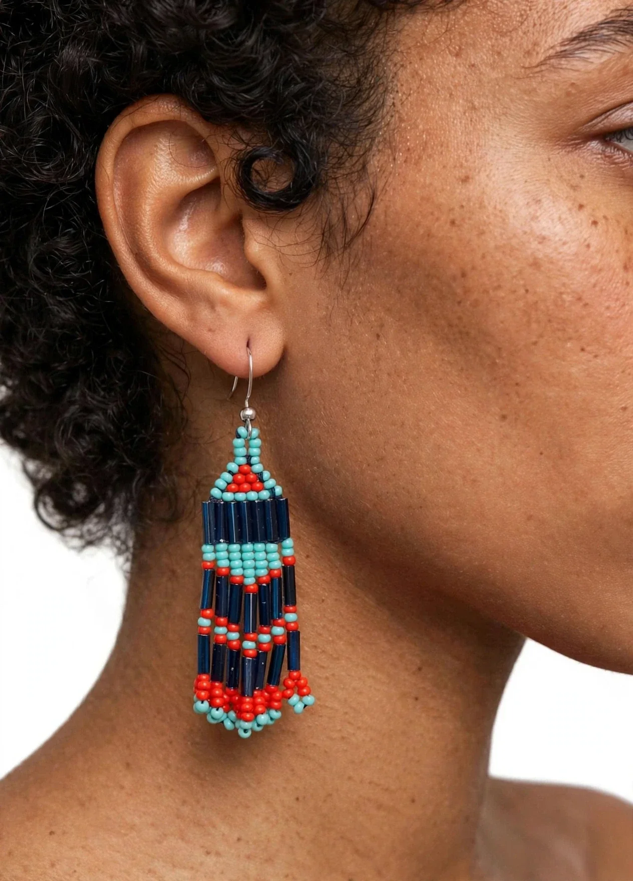 Elevate your look with these show-stopping 2-tier filigree chandelier earrings. Antique gold-tone openwork medallions with tiny crystal accents are linked to create dramatic length, finished with dangling marbled turquoise stone beads.  Each earring featu