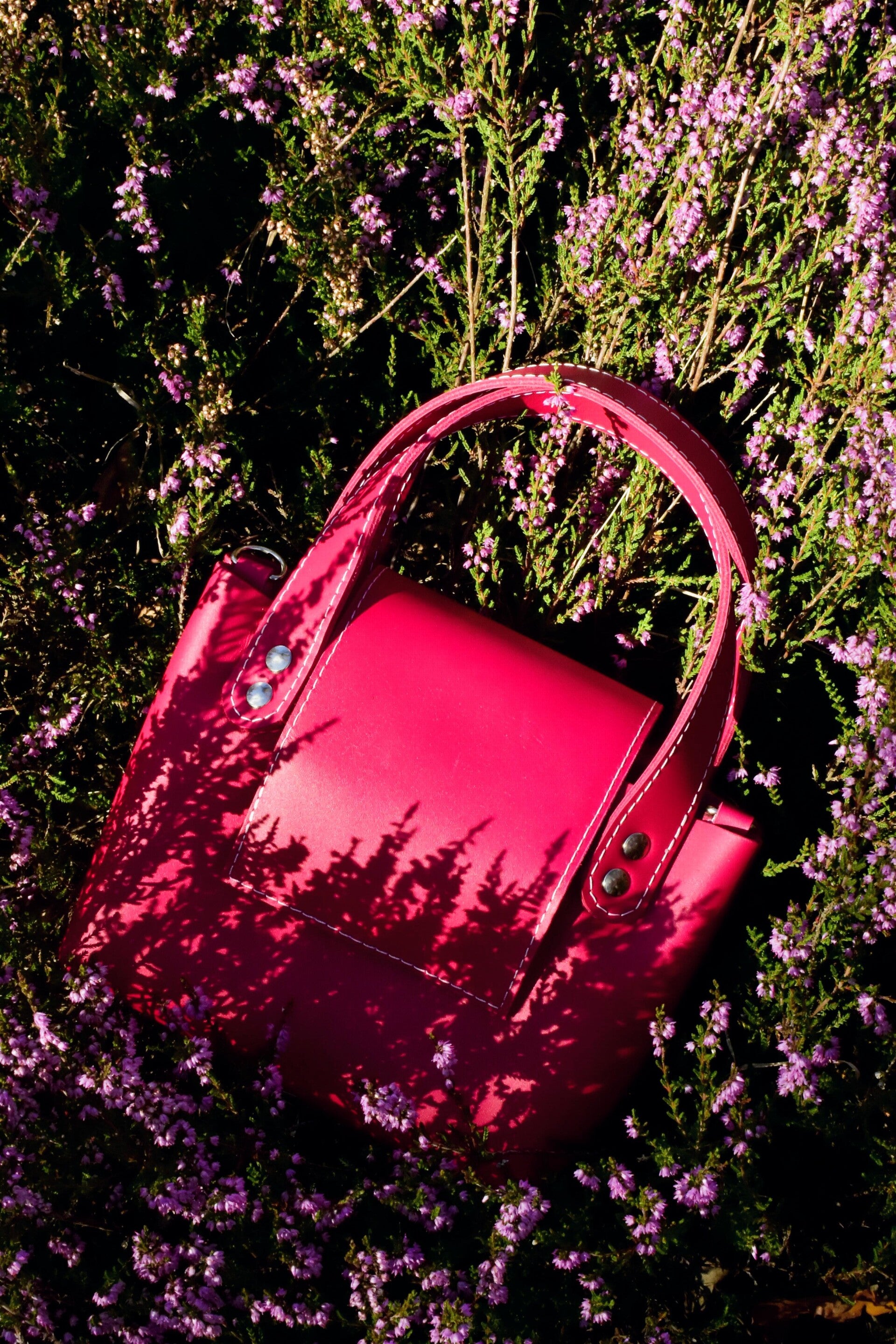 Roze handtas met lang hengsel
