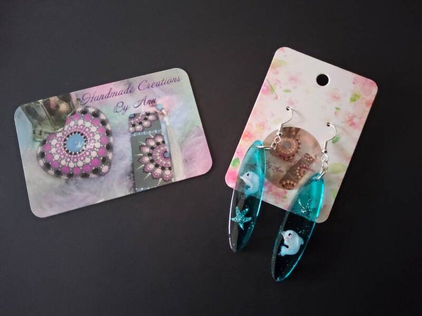 Uniek setje oorbellen met dolfijntjes en een zeesterretjes in .