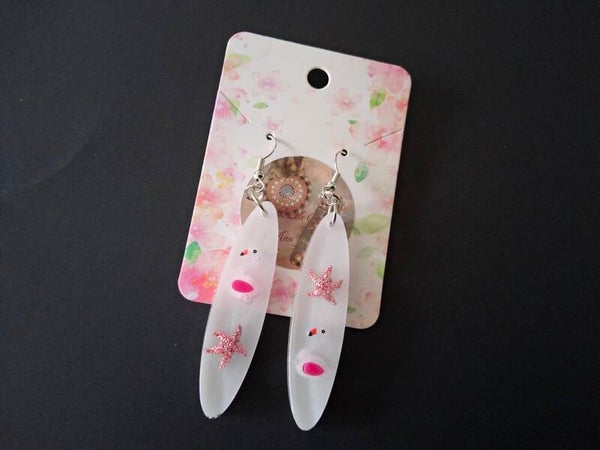 Uniek setje oorbellen met flamingo's en zeeserretjes in