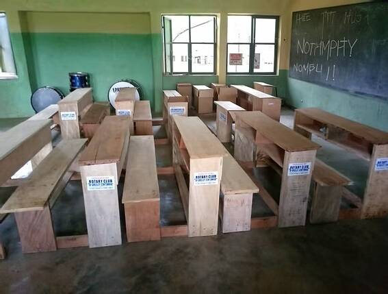 classroom with desks and blackboard