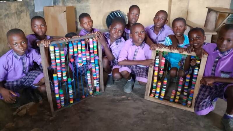 Students with locally made abacus 