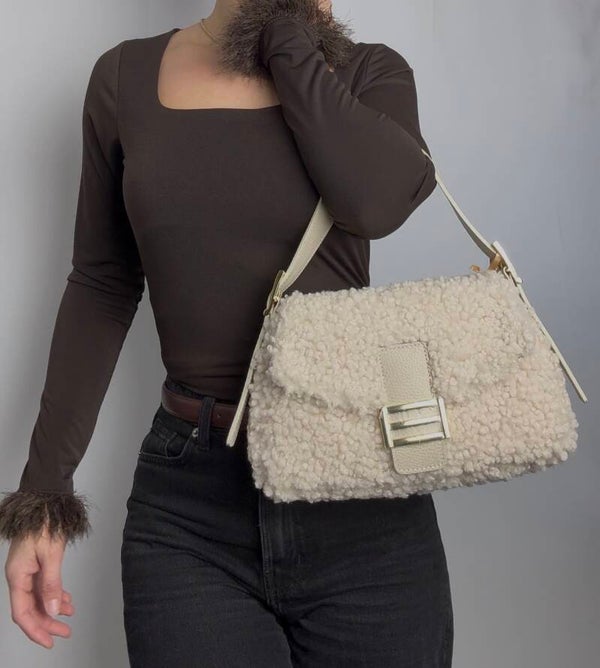 Dames top lange mouwen en veertjes