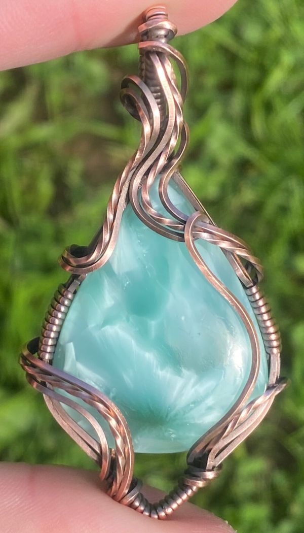 Dreamy Chatoyant glass pendant.