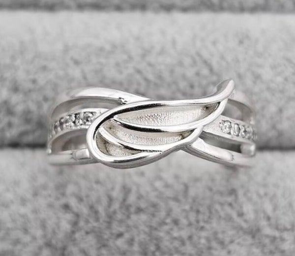 Solid silver angel wing ring with CZ