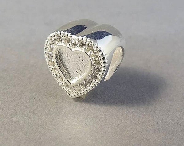 Solid silver heart charm with C Z