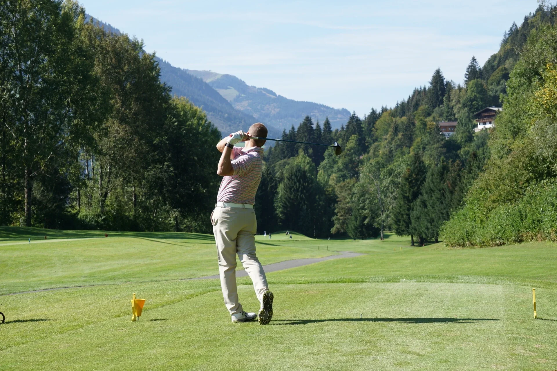 Golfer teeing off in Bolivia during a luxury golf tour in Bolivia with Bolivia Golf Tours