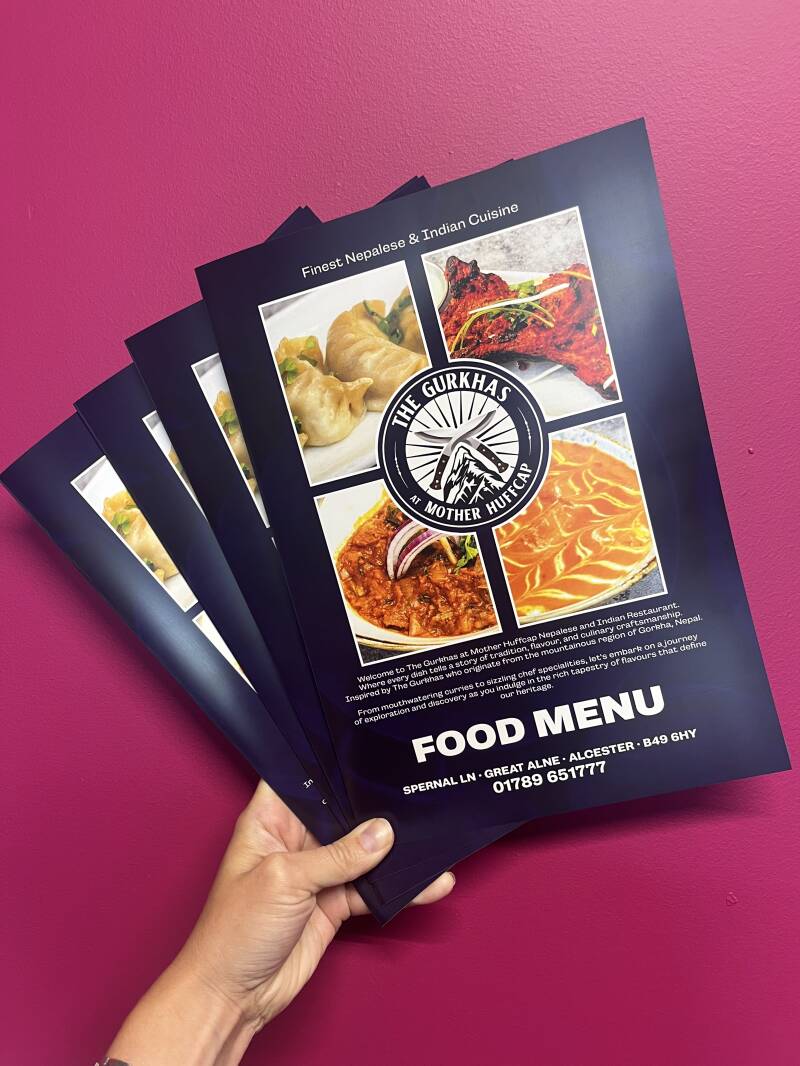Professionally printed restaurant menus showcasing high quality colour printing and a clean, detailed design