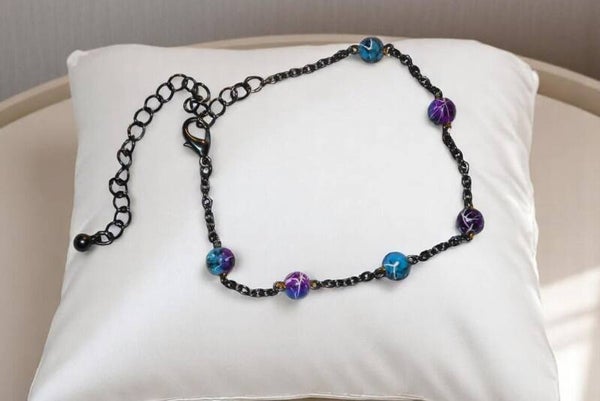 Bracelet 18 cm avec extension "Collection Apocalypse" composé de perles en verre et de chaîne en acier inoxydable