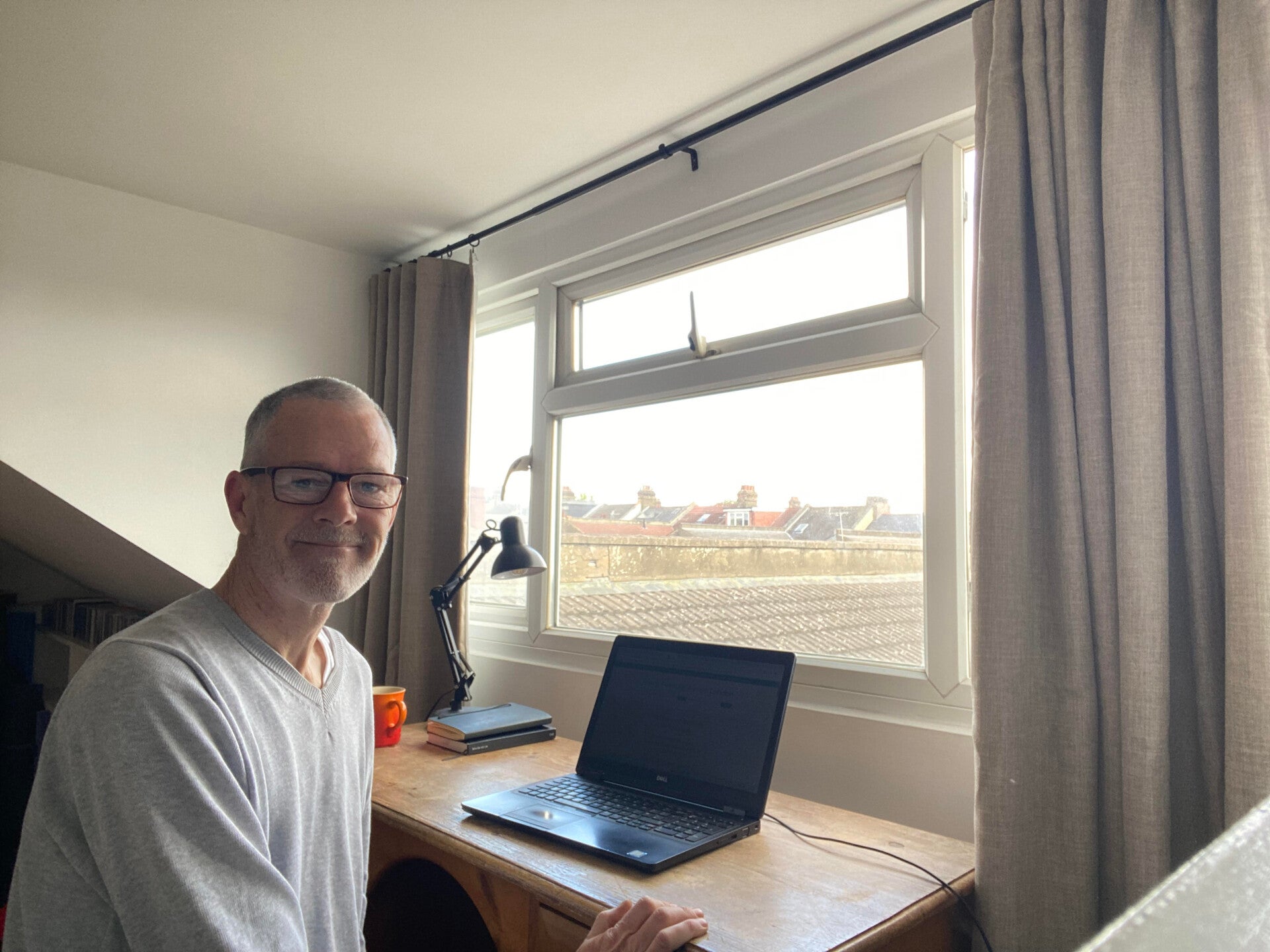 Johnathon Martin working at a computer writing and developing content for Young Men’s Resilience London, focused on creating mindfulness, mindset, and personal development resources to support teenage boys aged 15–18 with confidence, calmness, and emotion
