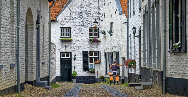 photo of Thorn village in Limburg, Netherlands, Mailman, Old City, City Centre, White Town, Holland, PostNL, Perrin Oubrie Photography