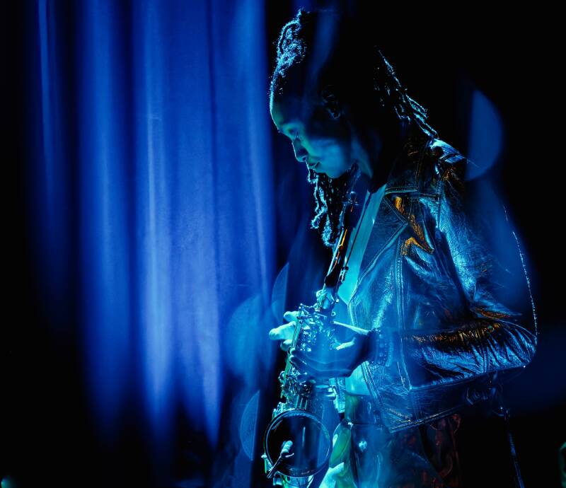 Alt Saxophone player Lakecia Benjamin from New York covered in blue stage lights during her live performance in jazz club Lantaren Venster in Rotterdam The Netherlands