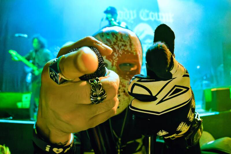 Picture of Lil Ice wearing a Purge mask during a live performance of metal band Body Count  during the song ' the Purge'