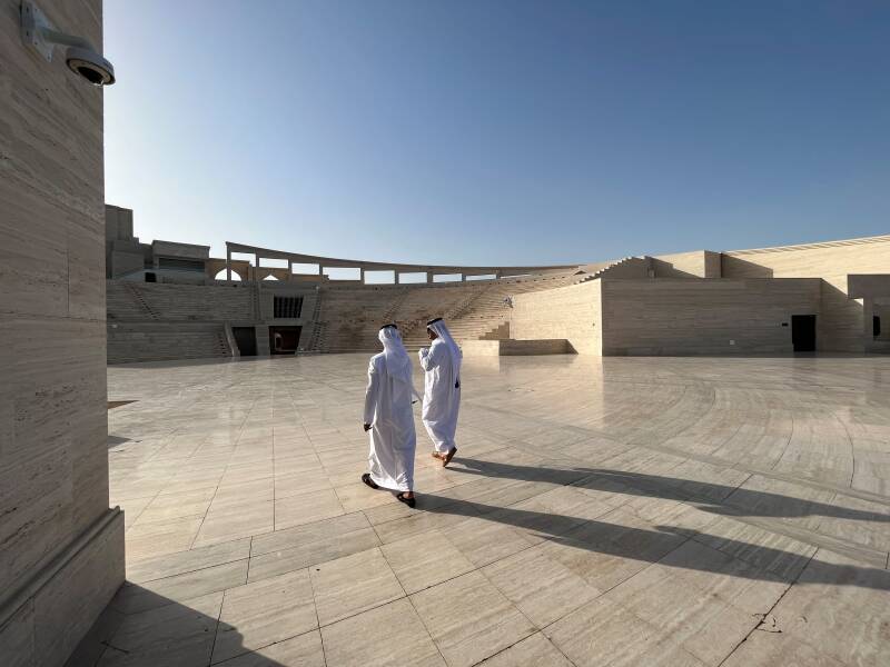 Two local arab men are having a look at the Amphitheater at Katara Cultural Village in Doha, Qatar