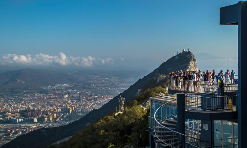 People on the observation deck on Top of the Rock in Gibraltar, are enjoying the view.