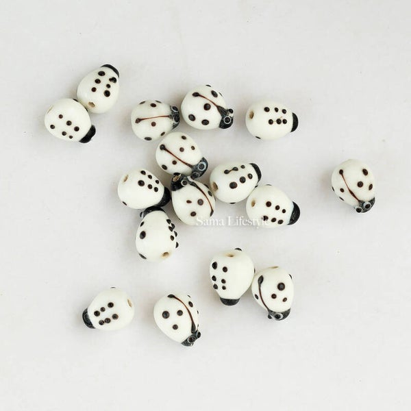 Glas - witte kapoentjes 12/10mm | per 16 stuks