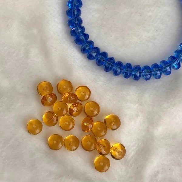 Tsjechisch glas - transparant oranje rondellen 6mm | per 20 gram