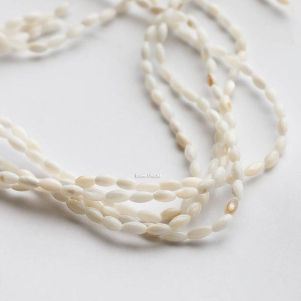 Schelp - creme schelp tonnetjes | per streng