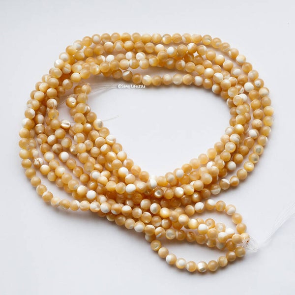 Schelp - Bruin/ creme kleurige ronde schelp kralen 5-6mm | per streng