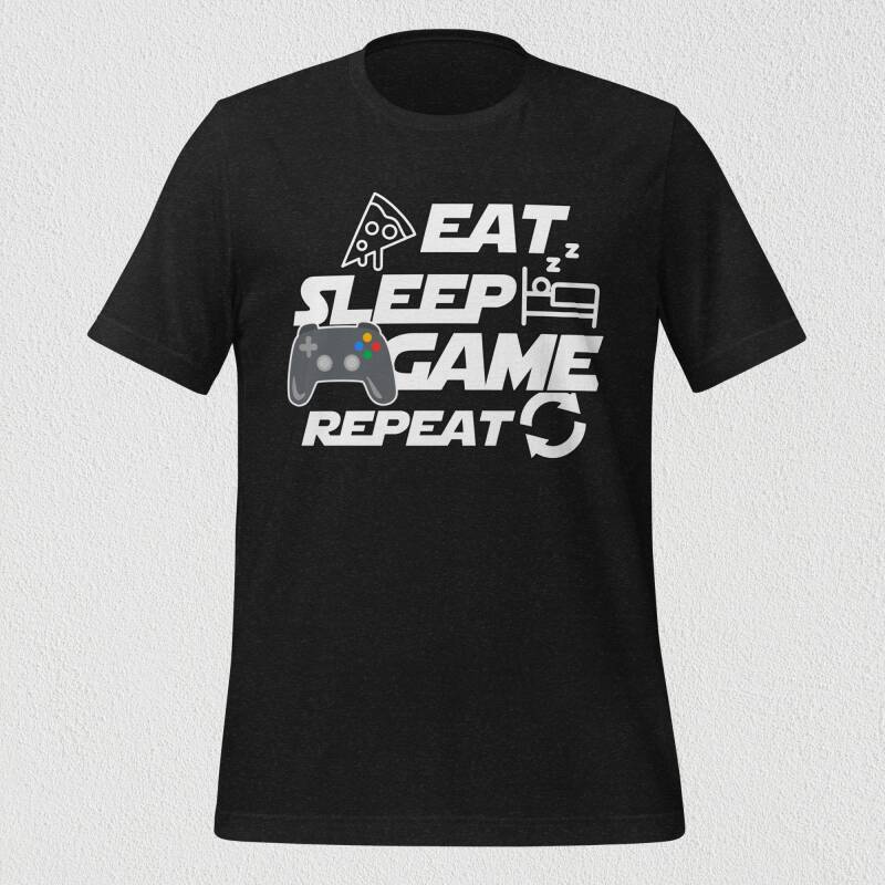 Camiseta "Eat, Sleep, GAME, Repeat" flotando sobre fondo liso, mostrando el diseño completo y el mando de consola a color.