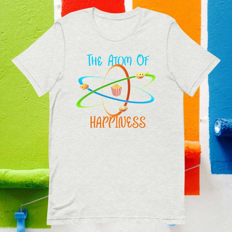 Camisetas estampadas átomo cuyo nucleo son las palomitas de maiz y cuyos electrones son emojis sonrientes
