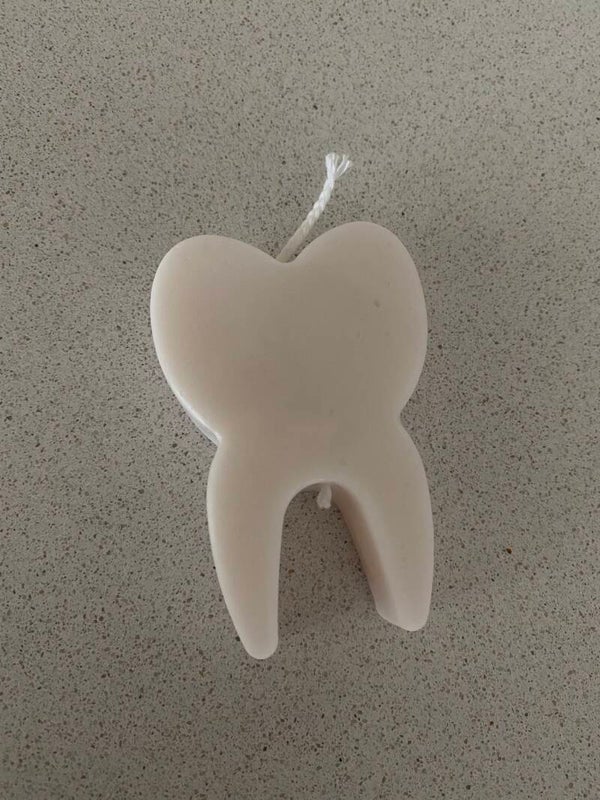 Vela forma de diente