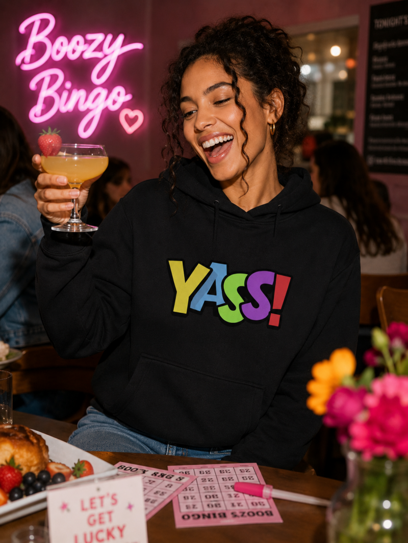 YASS! Bingo Customer with Cocktail enjoying Brunch Bingo in YASS! Merch