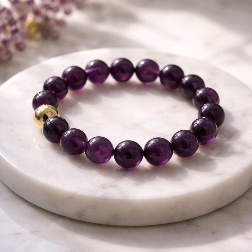 Bracelet Améthyste. Perle en acier. Fil élastique. Perles 8 mm.