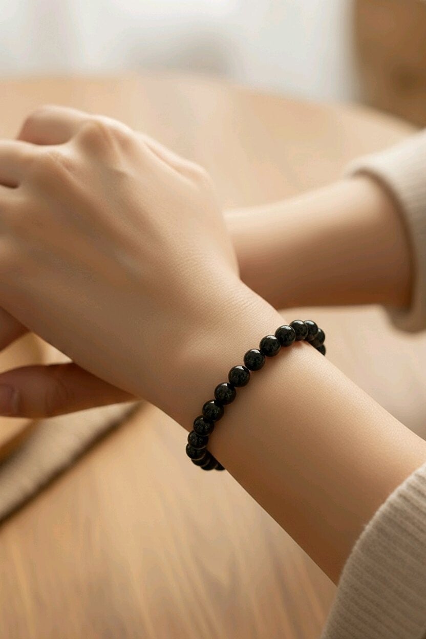 Bracelet Obsidienne. Perle en acier. Perles 10 mm