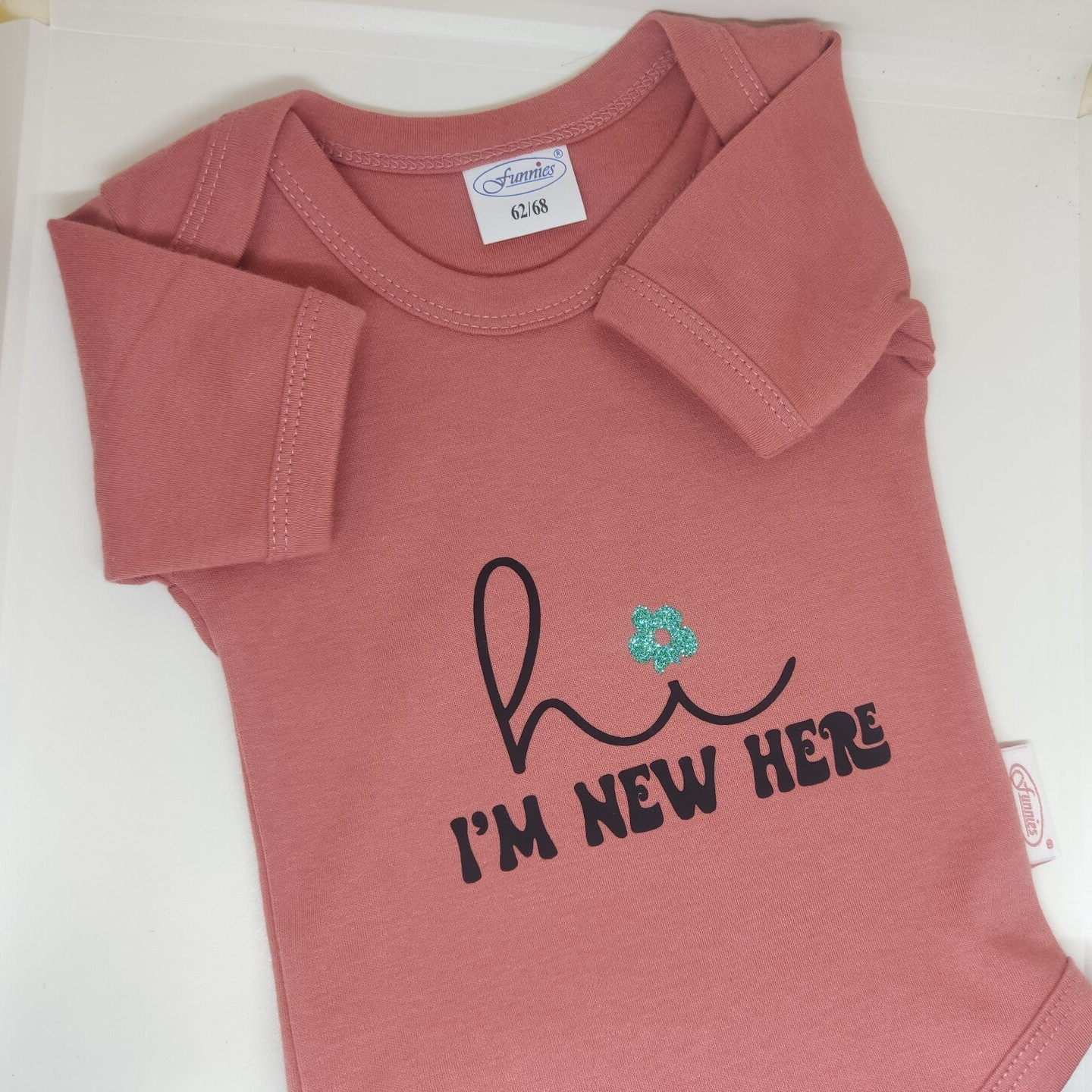 Romper oud roze met tekst Hi i'm new here 62/68