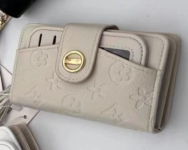 CARTERA SRA. ALARGADA REPUJADA 14x10cm