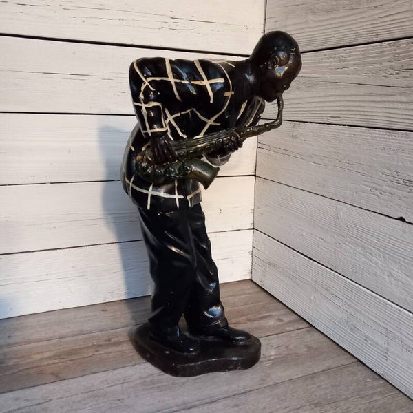 Swingend van beeld van een saxophonist.