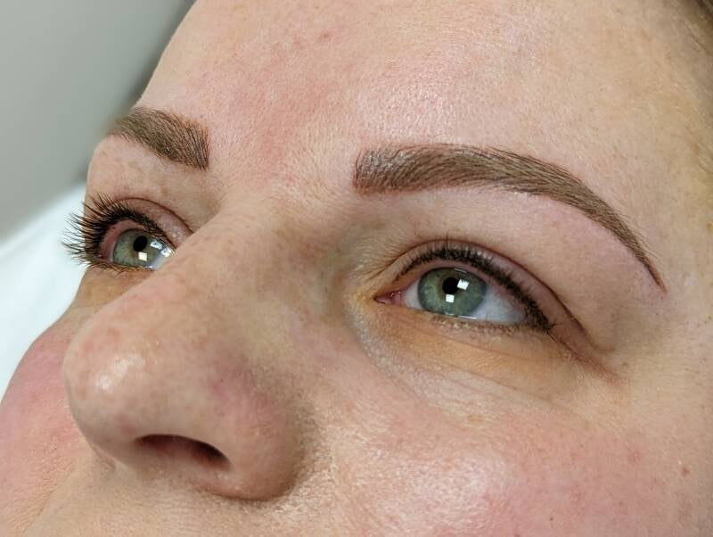 The image shows client after microblading, natural brow enhancement, and lash enhancement Semi-permanent Tattooh