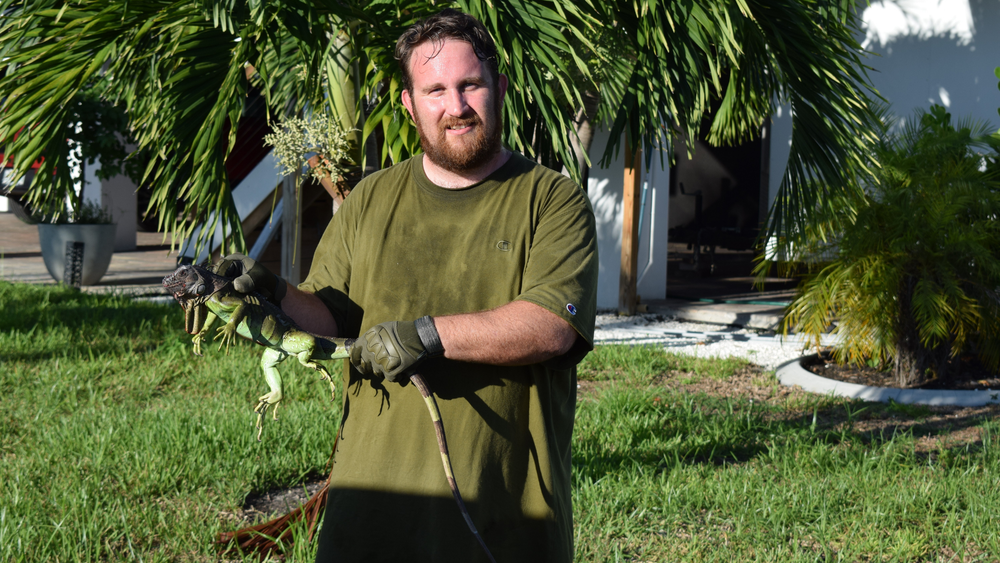 Phillip holding an iguana