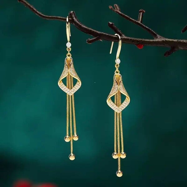 Boucles d'oreilles élégantes à pompons géométriques