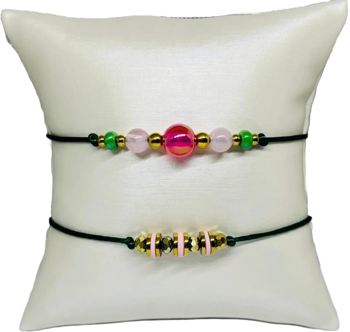 Armbandenset met gouden en roze kralen