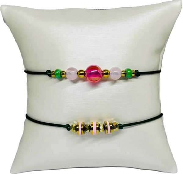 Armbandenset met gouden en roze kralen