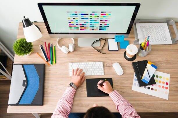 graphic designer working at computer - Empire Graphics