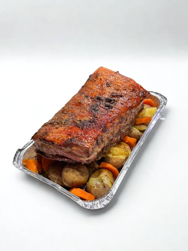Famoso Pork belly servido sobre papas salteadas y zanahoria