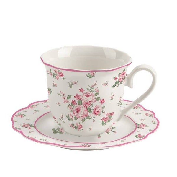 Kopje met onder bordje met bloemen