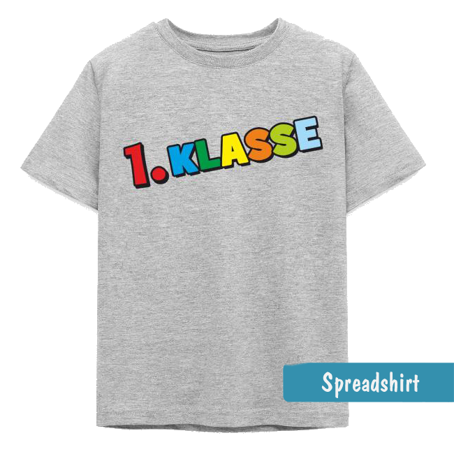 Graues Kinder-T-Shirt mit dem bunten Schriftzug „1. Klasse“ in verspielten Blockbuchstaben zum Schulstart.