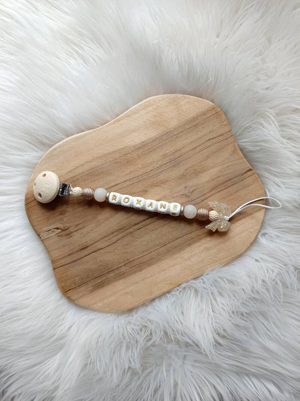 Attache tétine nœud pailleté